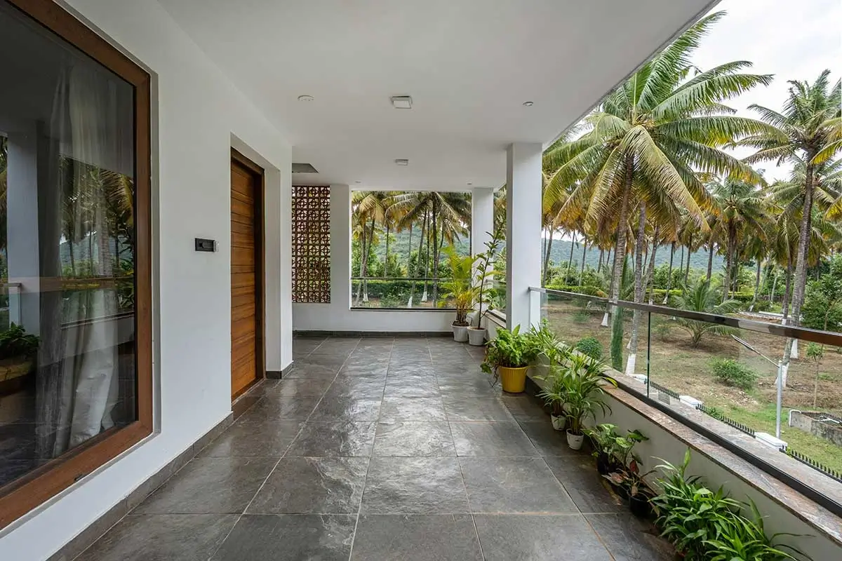 Scenic balcony with mountain views at Senaro Luxury Villa in Anaikatti, ideal for relaxing weekend stays