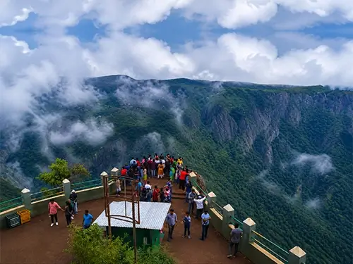Panoramic view from Dolphin's Nose View Point in Coonoor, Nilgiris with lush valleys and rolling hills.