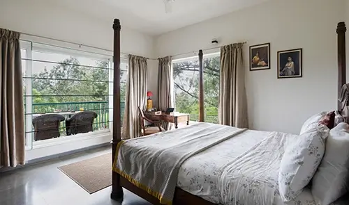 Comfortable Retreat Suite king bedroom at luxury villa in Kotagiri