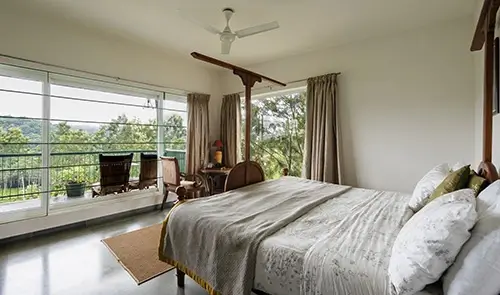 Spacious king bedroom in Signature Suite at luxury Kotagiri villa